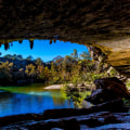 Swimming in the crystal clear waters of Hamilton Pool in Queensland