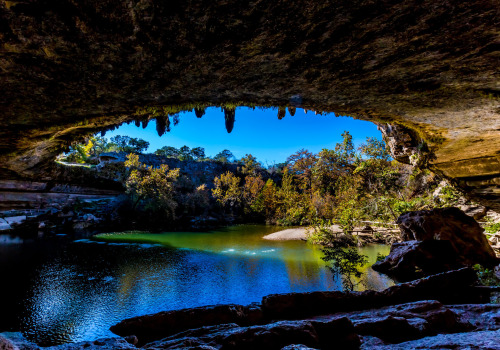 Swimming in the crystal clear waters of Hamilton Pool in Queensland